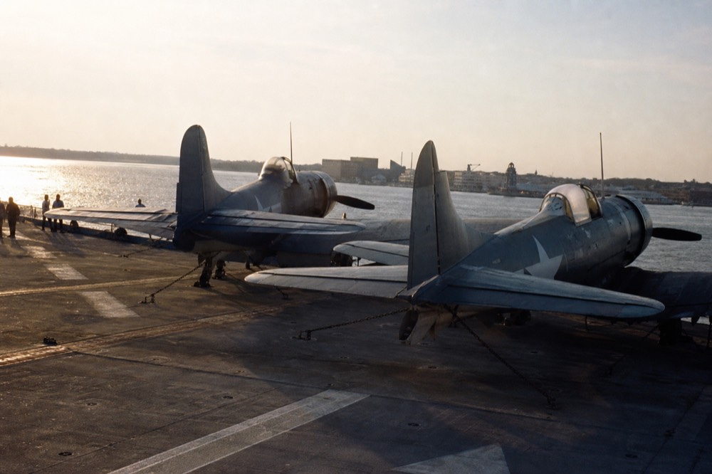 Flight deck of the USS Yorktown with vintage aircraft on display, no text, no logos, no people