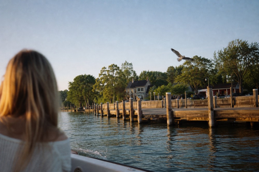 The Union Pier waterfront in downtown Charleston seen from the water at golden hour, no text, no logos, no people