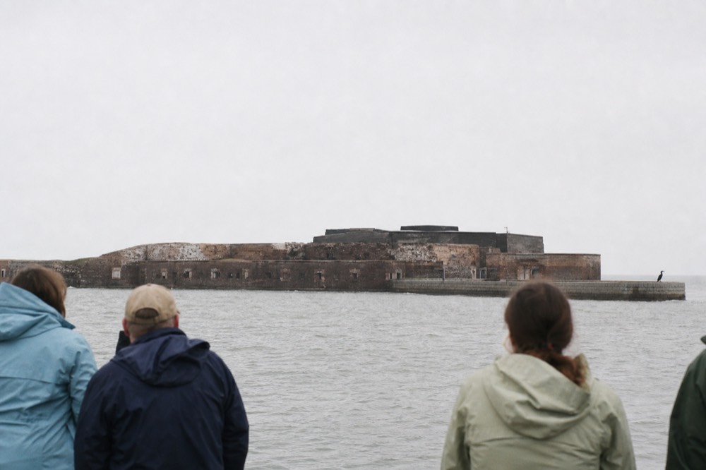 Fort Sumter's battered brick walls seen across open water, no text, no logos, no people