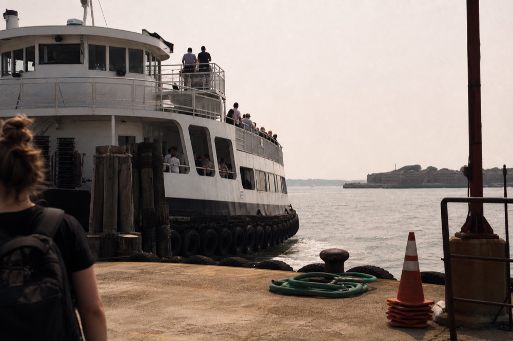 A passenger ferry approaching the dock at Fort Sumter, no text, no logos, no people